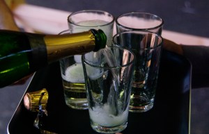 pouring wine into small glass